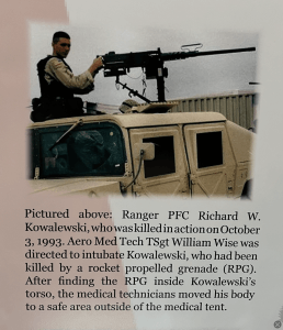 Image of Ranger Private Kowalewski in the turret of a tan hummer holding the handles of a 50 caliber machine gun