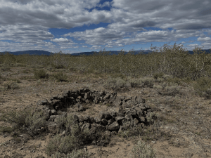 A circle of rocks large enough to enclose a five foot four inch person.